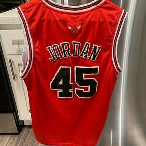 Bulls Michael Jordan 45 jersey in red. Size large. Lightly used.